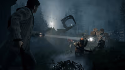Alan Wake shining a bright flashlight beam at a shadowy lumberjack enemy attacking him in a dark, foggy logging camp.
