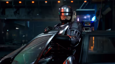 RoboCop standing beside a Detroit police cruiser on a dark city street in RoboCop: Rogue City.
