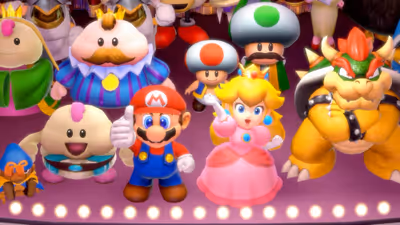A group of Super Mario RPG characters, MarioPrincess Peach waving, Bowser with crossed arms, and Mallow, standing together on a brightly lit stage