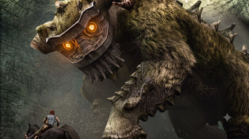 Wander riding his horse Agro facing Quadratus, the massive fur-covered second colossus with glowing orange eyes inside a rocky cavern in Shadow of the Colossus.