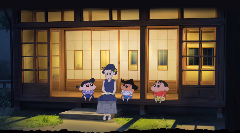 Shin-chan and friends listen to a woman reading from a book on a lit traditional Japanese engawa at night.