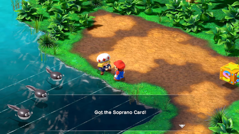 Mario receiving the Soprano Card from the composer Toadofsky at Melody Bay in the Super Mario RPG remake.